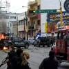 Cảnh sát liên bang Mexico điều tra một vụ tấn công xảy ra ngày 16/7. (Ảnh: AFP/TTXVN)