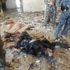 Xác một kẻ tấn công tại Baquba, Iraq, ngày 14/6. (Ảnh: AFP/TTXVN)