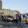 Tại hiện trường vụ đánh bom ở thành phố Sadr, phía Đông thủ đô Baghdad, ngày 23/7. (Ảnh: AFP/TTXVN)