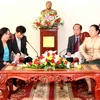 Bộ trưởng Onchanh Thammavong tiếp Bộ trưởng Phạm Thị Hải Chuyền. (Ảnh: Hoàng Chương/Vietnam+)
