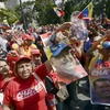 Những người ủng hộ Tổng thống Hugo Chavez tuần hành trên các đường phố ở Caracas ngày 18/2. (Ảnh: AFP/TTXVN)