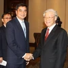 Tổng Bí thư Nguyễn Phú Trọng tiếp Chủ tịch Đảng Dân chủ Thái Lan, Ngài Abhisit Vejjajiva. (Ảnh: Trí Dũng/TTXVN)