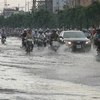 Thành phố Hồ Chí Minh bị tác động của biến đổi khí hậu gây mưa lớn khiến đường phố ngập lụt nghiêm trọng. (Ảnh: Hoàng Hải/TTXVN)