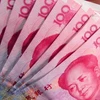 Những đồng tiền Trung Quốc mệnh giá 100 Nhân dân tệ. (Nguồn: AFP/TTXVN)