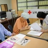 Các cụ già Hàn Quốc đăng ký tham gia chương trình đoàn tụ gia đình tại văn phòng Hội Chữ thập Đỏ ở Seoul ngày 13/9. Ảnh minh họa. (Nguồn: AFP/TTXVN)