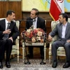 Tổng thống Iran Mahmoud Ahmadinejad (bên phải) hội đàm với người đồng cấp Syria Bashar al-Assad tại Tehran ngày 2/10. (Nguồn: Getty Images) 