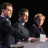 Thủ tướng Đức Merkel, Tổng thống Pháp Sarkozy và Tổng thống Nga Medvedev trong cuộc họp báo ngày 19/10. (Nguồn: Getty Images)