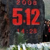 Người dân Trung Quốc kỷ niệm 1 năm ngày xảy ra trận động đất ở Tứ Xuyên, Trung Quốc vào ngày 12/5/2009. (Nguồn: THX/TTXVN) 