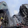 Một phần tòa nhà Central World từng bị hư hại do bị đốt phá hồi tháng Năm. (Nguồn: Getty Images)