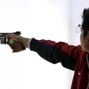Xạ thủ Hà Minh Thanh thi đấu ở nội dung 25mt súng ngắn liên thanh đồng đội nam .(Nguồn: THX/TTXVN)