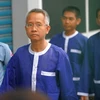 Các công dân Thái Lan bị áp giải tới phiên tòa ngày 6/1. (Nguồn: AFP/TTXVN)