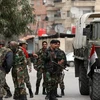 Xe tăng quân chính phủ án ngữ tại một đường phố ở quận Harasta, gần Damascus ngày 15/2/2012. (Nguồn: AFP/TTXVN)