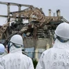 Ủy ban điều tra sự cố hạt nhân tại tòa nhà chứa lò phản ứng số 3 nhà máy điện Fukushima, tỉnh Fukushima hồi tháng 6/2011. (Nguồn: AFP/TTXVN)