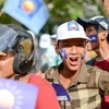 Cử tri tham gia chiến dịch vận động bầu cử Quốc hội Campuchia khóa V hôm 28/7. (Ảnh: demotix.com)