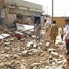 Hiện trường một vụ đánh bom ở thành phố Fallujah ngày 10/5. (Nguồn: AP)