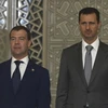 Tổng thống Nga Dmitry Medvedev và Tổng thống Syria Bashar al-Assad. (Nguồn: Reuters)