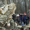 Các nhân viên cứu hộ Nga làm nhiệm vụ tại hiện trường vụ tai nạn. (Nguồn: AFP/TTXVN) 