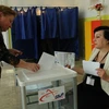 Người dân Gruzia bỏ phiếu tại một điểm bầu cử ở Tbilisi ngày 30/5. (Nguồn: AFP/TTXVN)