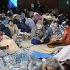 Người dân Nhật sơ tán sau động đất-sóng thần. (Nguồn: AFP/TTXVN)