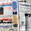 Các báo Lào ra ngày 21/6. (Ảnh: Hoàng Chương/Vietnam+)