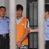 Fu Xuesheng bị cảnh sát bắt giữ. (Nguồn: Xinhua)