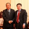Phó Thủ tướng Lào Asang Laoly và Phó Chủ nhiệm Văn phòng Chính phủ Nguyễn Quang Thắng. (Ảnh: Hoàng Chương/Vietnam+)