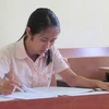 Thí sinh làm bài thi môn Văn tại Hội đồng thi Học viện Ngoại giao. (Ảnh: Phạm Mai/Vietnam+).