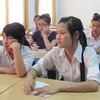 Thí sinh làm thủ tục dự thi tại Đại học Hà Nội. (Ảnh: Phạm Mai/Vietnam).