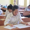 Thí sinh làm bài thi môn Văn tại Hội đồng thi Học viện Ngoại giao. (Ảnh: Phạm Mai/Vietnam+)