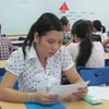 Thí sinh làm thủ tục dự thi tại Trường đại học Hà Nội năm 2010. (Ảnh: Phạm Mai/Vietnam+).