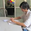 Thí sinh làm hồ sơ dự thi năm 2011. (Ảnh: Phạm Mai/Vietnam+)