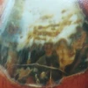 Khối gỗ hóa thạch có họa tiết, hoa văn mang hình ảnh Bác Hồ làm việc tại hang Pắc Bó. (Ảnh: Thiên Linh/Vietnam+)