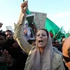 Bà Aisha Gaddafi lên án NATO đã phạm "tội ác chiến tranh" khi tiến hành không kích vào nhà dân, làm em trai và con gái bà thiệt mạng (Nguồn: EPA)