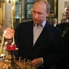 Thủ tướng Nga Vladimir Putin đã dự lễ Giáng sinh của đạo Chính thống tại một nhà thờ ở St Petersburg, nơi ông từng được rửa tội. (Nguồn: AFP)