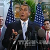 Chủ tịch Hạ viện Mỹ John Boehner (trước) sau cuộc họp của Hạ viện ở Washington, DC ngày 15/10. AFP/ TTXVN