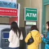 Người dân được khuyến cáo người dân chỉ nên rút tiền khi máy ATM khô ráo. (Ảnh minh họa. Nguồn: Internet) 