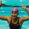 Nữ vận động viên Việt Nam Dương Thị Huyền Trang mừng thắng lợi giành huy chương vàng của đội. (Ảnh Hồng Kỳ/TTXVN)