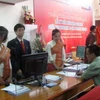 Giao dịch VietinBank chi nhánh tại Lào. (Ảnh: Vietnam+). 