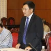 Thứ trưởng Bộ ngoại giao Phạm Bình Minh trình bày Báo cáo của Chính phủ về tình hình thế giới và công tác đối ngoại của Nhà nước năm 2009. (Ảnh: Trí Dũng/TTXVN)