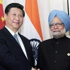 Chủ tịch Trung Quốc Tập Cận Bình và Thủ tướng Ấn Độ Manmohan Singh. (Ảnh: AFP)