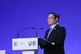 Thủ tướng Phạm Minh Chính phát biểu tại Hội nghị Thượng đỉnh Khí hậu trong khuôn khổ Hội nghị lần thứ 26 các Bên tham gia Công ước khung của Liên hợp quốc về Biến đổi khí hậu (COP26) năm 2021. (Ảnh: Dương Giang/TTXVN)