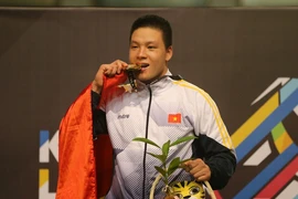 VĐV Nguyễn Văn Trí giành huy chương vàng ở nội dung đối kháng hạng cân 90kg nam. (Ảnh: Quốc Khánh/TTXVN)