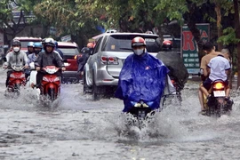 Một tuyến đường bị ngập vì mưa lớn ở Thành phố Hồ Chí Minh. (Ảnh: Hồng Giang/TTXVN)