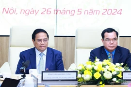 Thủ tướng Phạm Minh Chính phát biểu tại Hội nghị đánh giá việc thực hiện quy chế về mối quan hệ công tác giữa Chính phủ với Tổng Liên đoàn Lao động Việt Nam. (Ảnh: Dương Giang/TTXVN)
