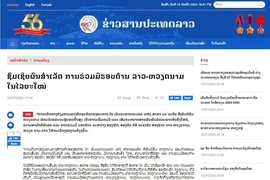 Bài viết trên trang điện tử của Thông tấn xã Lào (KPL). (Ảnh: Đỗ Bá Thành/TTXVN)