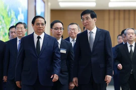 Thủ tướng Phạm Minh Chính tiếp Chủ tịch Chính hiệp Trung Quốc Vương Hộ Ninh. (Ảnh: Dương Giang/TTXVN)