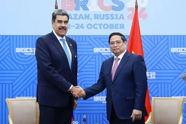 Thủ tướng Phạm Minh Chính gặp Tổng thống Venezuela Nicolas Maduro. (Ảnh: Dương Giang/TTXVN)