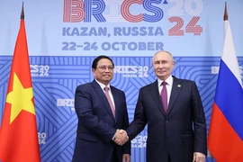 Thủ tướng Phạm Minh Chính với Tổng thống Liên bang Nga Vladimir Putin, Chủ tịch Nhóm BRICS năm 2024. (Ảnh: Dương Giang/TTXVN)