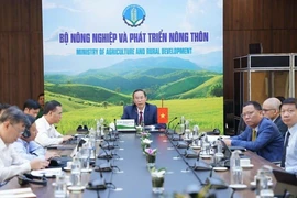 Thứ trưởng Bộ Nông nghiệp và Phát triển nông thôn Phùng Đức Tiến tham dự hội nghị tại điểm cầu Việt Nam.(Ảnh: TTXVN)