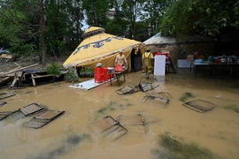 Cảnh ngập lụt sau những trận mưa lớn tại Thanh Viễn, tỉnh Quảng Đông, Trung Quốc. (Ảnh: AFP/TTXVN)